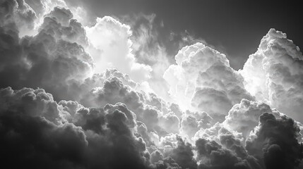 Obraz premium Dramatic cloud forms sky black and white photography atmospheric aerial view high contrast visuals