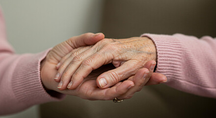 Elderly Person s Hand Held by Younger Person Showing Care and Support