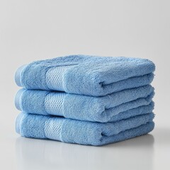 Terry towel isolate. Blue towels stack isolate on white background. Bath terry towel. Bath towels.