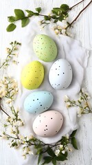 Obraz premium Pastel Easter Eggs Decorated with Dots on White Wooden Background