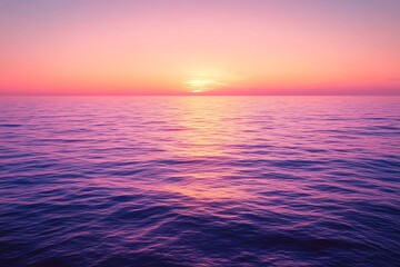A serene sunset over a calm ocean, with the sky painted in shades of pink, orange, and purple