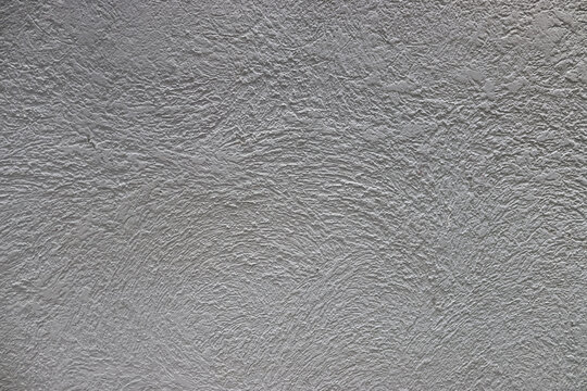 Textura r&uacute;stica blanca. Superficie encalada retro de la pared vieja. Estructuras antiguas. Grungy us&oacute; yeso pintado desigual. Blanquear el fondo de la fachada
