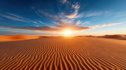 Naklejka premium An awe-inspiring view of sandy desert dunes capturing the moment of sunrise, showcasing a beautiful blend of colors and textures that evoke a sense of freedom and exploration.