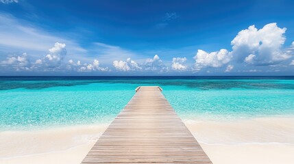 Naklejka premium Wooden pier extending from a luxury beachfront resort into a calm turquoise sea.