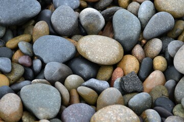 Textured background weathered stones on the beach