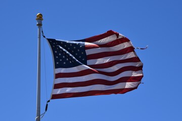 american flag and blue sky
