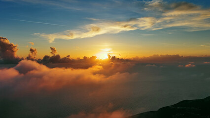 Aerial view of bright sunset clouds