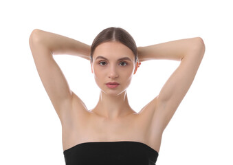 Fototapeta premium Young woman showing smooth skin after epilation on white background