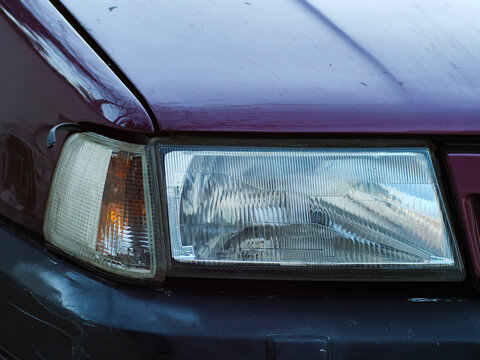 Close-up Detail of the Front Halogen Headlight of a Fiat Tempra, Old Technology