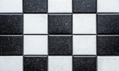Classic black and white checkerboard tile pattern creates a timeless and versatile background texture.
