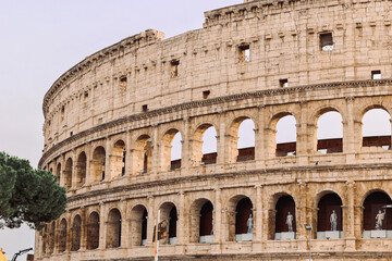Fototapeta premium Panoramic view of old Colosseum in Rome. Beautiful popular of ancient landmark. Famous card of city of Rome, Italy