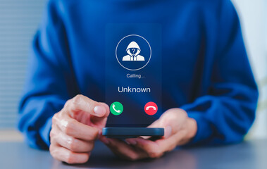 Fraud and phishing concept. Man holding mobile phone with incoming call from unknown caller....