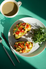 Italian bruschetta with omelette, tomatoes and herbs. A balanced breakfast