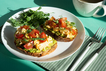 Italian bruschetta with omelette, tomatoes and herbs. A balanced breakfast