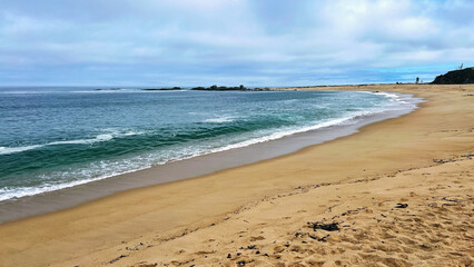 Beach with golden sand and crystal-clear water