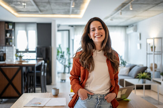 Young businesswoman smiling in her modern home office
