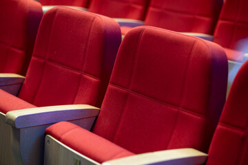 Fototapeta premium Comfortable red theater seats arranged in a cozy setting ideal for entertainment and performances