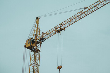Construction site with a tower crane. Construction of residential buildings. Panoramic view of the construction of skyscrapers. Landscape with a modern city