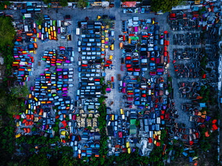assorted colors of plastic molds in a vacant lot