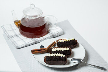 Chocolate Potato Cake with Cream and Teapot of Tea