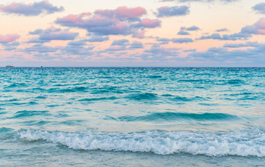 Sunset seascape at summer vacation. Sunrise with sea beach. Dramatic sunrise horizon at sea. Romantic summer vacation on sunset seascape. Sea sunset on ocean. Sea breeze