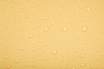 Beige plastic with drops as a background.