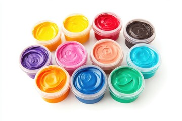 Assortment of colorful paint pots arranged on a white surface in a studio setting for art projects