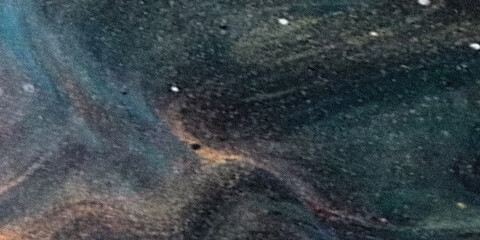 Abstract texture with swirling patterns in shades of blue brown and white creating a cosmic effect