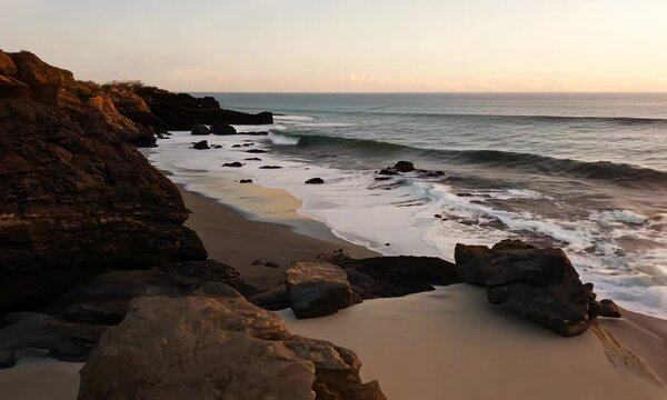 Sand beach among rocks at Atlantic Ocean coast in Portugal