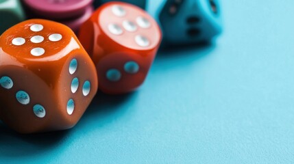 Close-up view of colorful dice arranged on a blue surface, perfect for gaming and tabletop activities