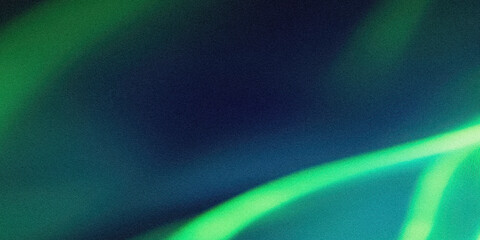 Abstract image featuring green and blue hues with blurred light streaks in a dark background