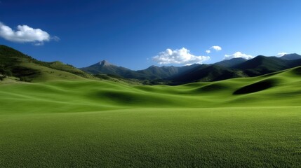Lush green valley stretches beneath a clear blue sky, dotted with rolling hills and distant mountains
