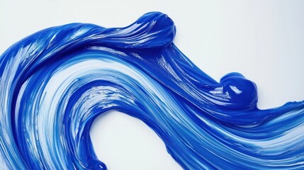 Vibrant blue paint swirls artistically across a white canvas, evoking creativity and fluidity