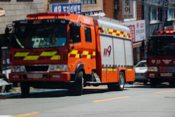 South Korean Fire fighting brigade equipment, during operation in the streets, firefighters with fire engine truck vehicle, 911 emergency and rescue, fire drill exercise training, Busan, South Korea