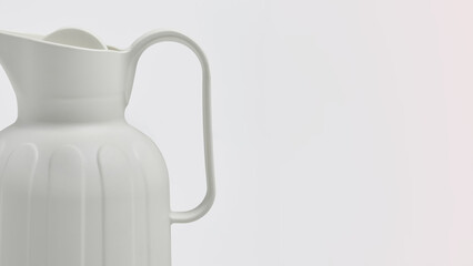 Closeup of a white jug on copy-space background.