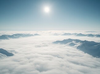 Naklejka premium The top of the snow mountain, overlooking clouds and fog below, covered with deep white powder on both side