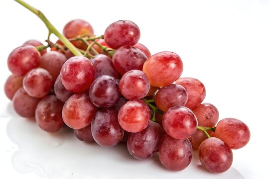 A bunch of red grapes with green stem isolated on a white background close up