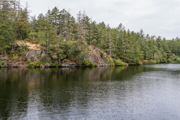 Thetis lake at Thetis Lake Regional Park calm water and overcast day