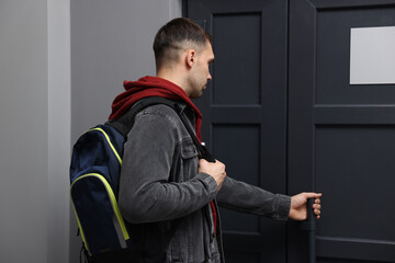 Man knocking on door of his friends apartment