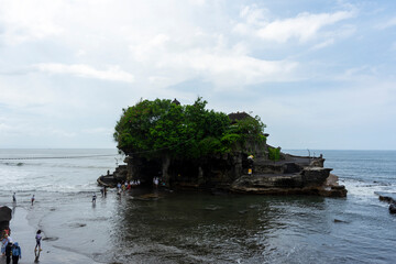 Tanah Lot Temple is a unique temple built on a rocky island in the sea, located on the coast of Tabanan. This is also a sea temple dedicated to the god of the sea.