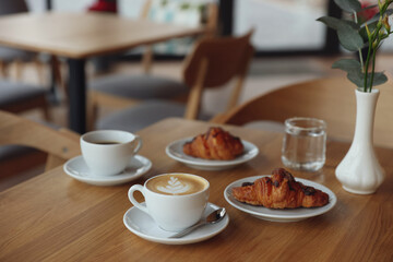 Delicious breakfast served on wooden table in cafe