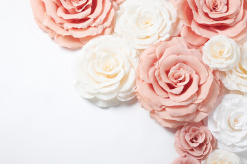 Beautiful paper flowers on white background, flat lay. Space for text