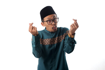 Asian Muslim man making money gesture with his hands, asking for salary payment, THR (Holiday...