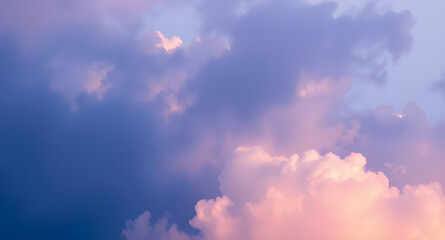 A pastel sky filled with fluffy clouds and soft light