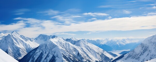 Fototapeta premium Majestic Snowy Mountain Range with Blue Sky