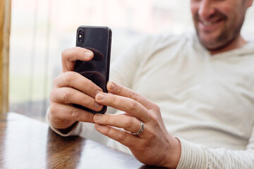 happy man taking photo with his phone