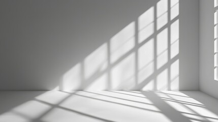 Fototapeta premium Minimalistic abstract light gray background for product presentation with light and intricate shadow from window on wall.