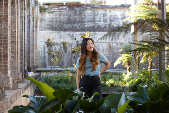 Young Asian woman enjoying time outdoors at enclave