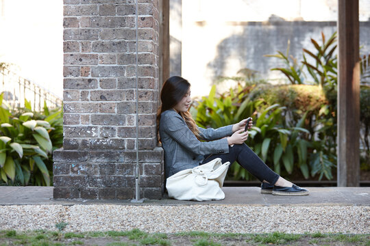 Young Asian woman enjoying time outdoors at enclave