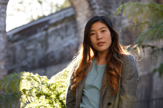 Young Asian woman enjoying time outdoors at enclave